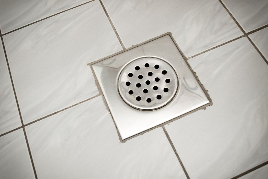 shower drain clogged with conditioner residue